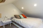 Queen size bed in the loft area